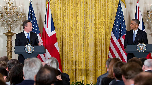 אובמה וקמרון בבית הלבן (צילום: AFP) (צילום: AFP)
