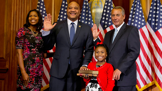 Carson gets sworn in by House Speaker Boehner. (Photo: Associated Press)