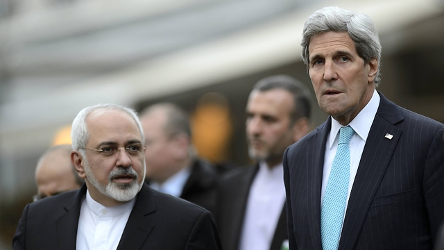 Kerry and Iranian FM Mohammad Javal Zarif in Geneva on Wednesday. (Photo: Associated Press)