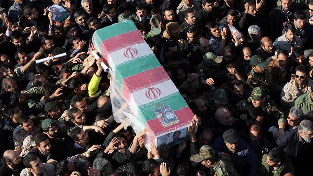Iranian mourners carry the coffin of General Mohammad Ali Allahdadi (Photo: AFP) (Photo: AFP)