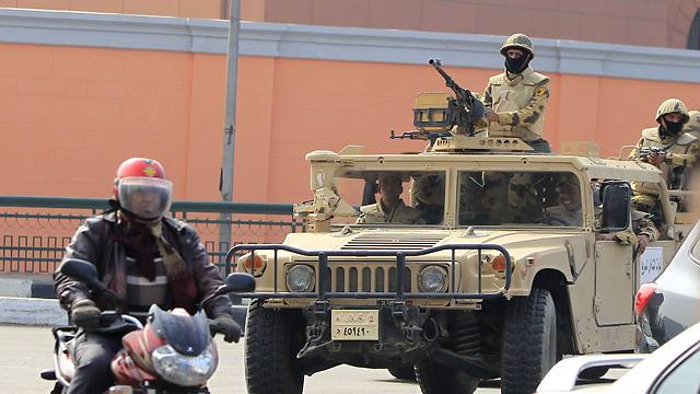 Soldiers in armored vehicles patrol streets (Photo: Reuters)