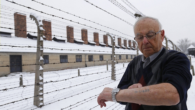 Survivor Jack Rosenthal from the US displays his prisoner number (Photo: Reuters)