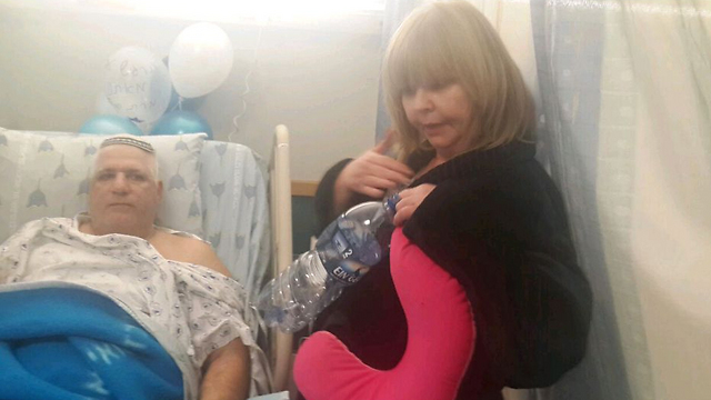 Passenger Larissa Ostimenko visits Biton in the hospital. (Photo: Itay Blumenthal)