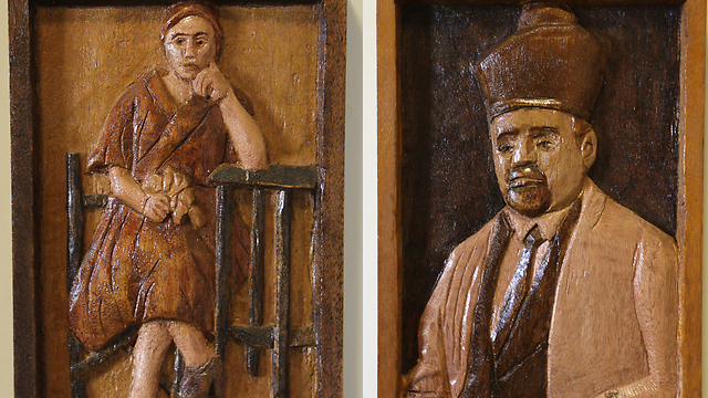 Arad's carvings of his parents, Israel and Chaya Moshe. 'They suffered the same fate as the remaining Jews of Poland' (Photo: Zvika Tishler) 