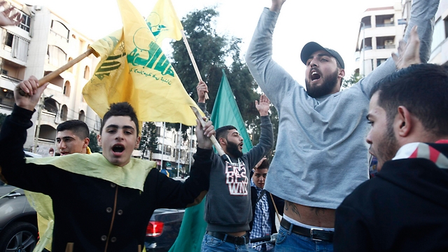 Hezbollah supporters launch 'victory parade' in Beirut (Photo: Reuters)