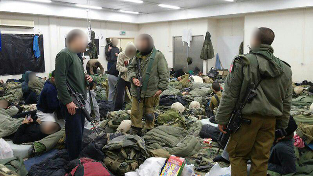 Soldiers sleeping on the floor
