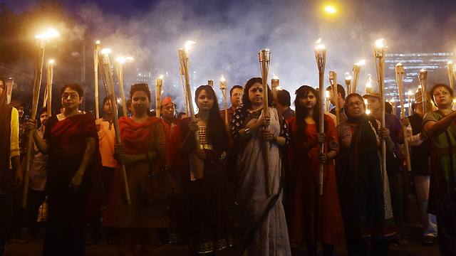 Bangladeshi secular activists take part in a torch-lit protest against the killing (Photo: AFP)