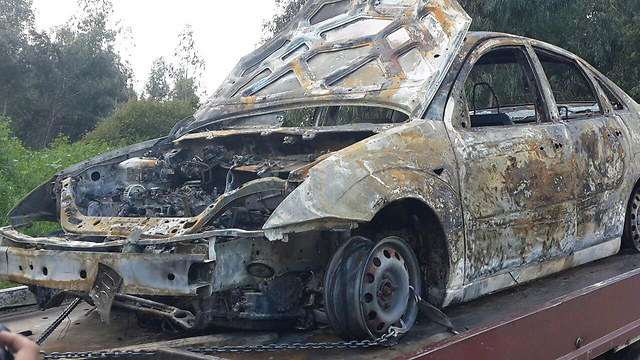 הרכב השרוף שבו הוצתה למוות חאג' יחיא בידי הנאשם ()