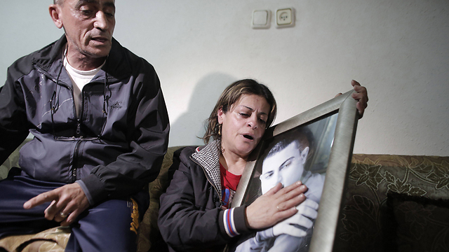 Mohamed Musallam's parents after learning about their son's death (Photo: AFP)