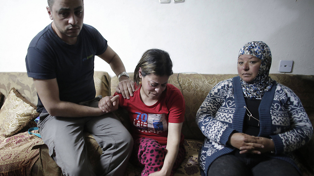 The Musallam family in their home after learning of Mohamed's death (Photo: AFP)