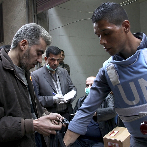 UN aid workers at Yarmouk refugee camp in Syria. (Photo: Reuters)