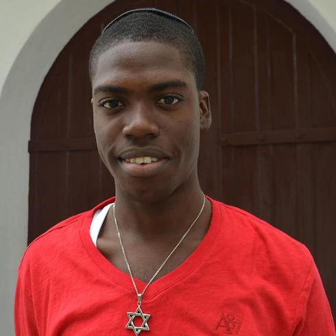 Mickel Hylton, 18, poses for picture in front of  Sha’are Shalom synagogue, in Kingston, Jamaica (Photo: AP) (Photo: AP)