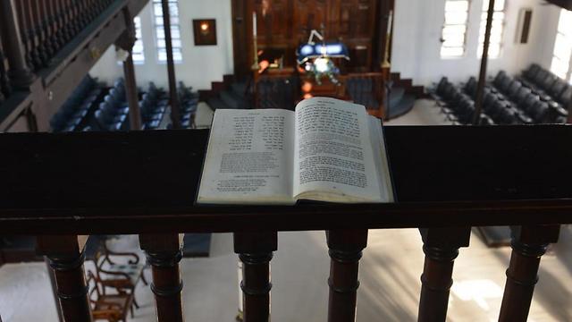 Hebrew prayer book propped on railing of the Shaare Shalom (Photo: AP) (Photo: AP)