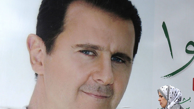 Assad billboard in Damascus (Photo: AFP)