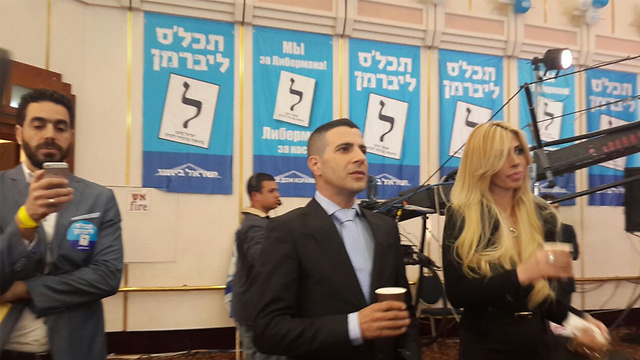 Yisrael Beytenu's Sharon Gal watching the exit polls (Photo: Ilana Curiel)