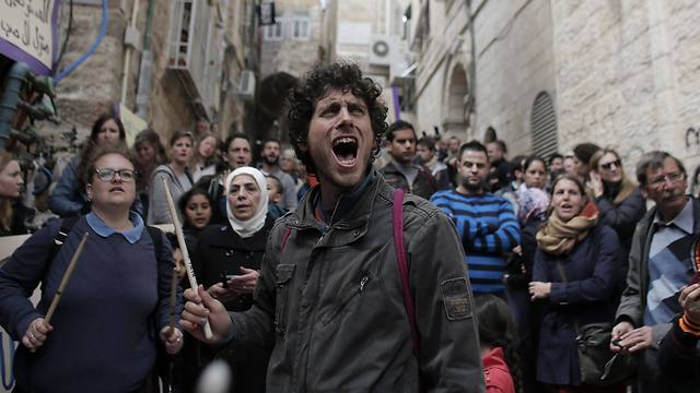 Israeli and foreign peace activists join Palestinian protesters in a demonstration in the Old City of Jerusalem (Photo: AFP)