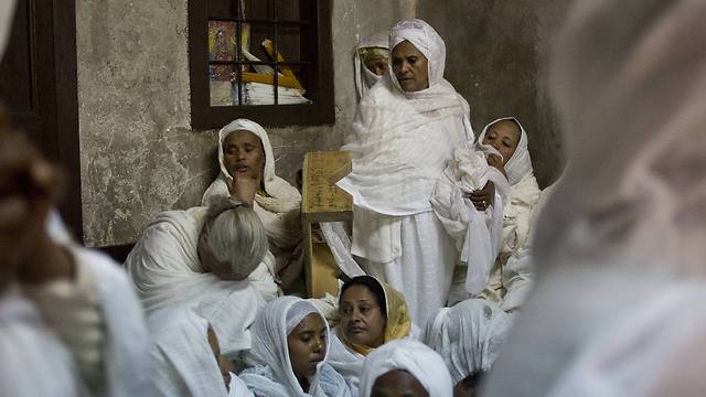 Ethiopian Orthodox Christian women pray at Deir El Sultan outside the Church of the Holy Sepulcher during Orthodox Palm Sunday in Jerusalem (Photo: AP)