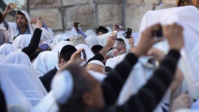 Haredi men taking selfies at the Western Wall. 'There is something refreshing about the Israeli society when it comes to Jewish culture' (Photo: AFP)