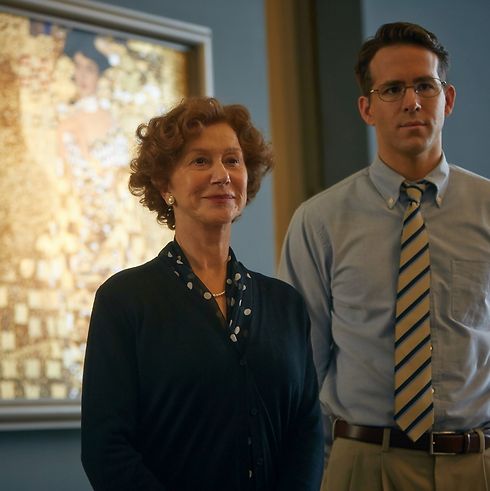Mirren with co-star Ryan Reynolds standing in front of the famous 'Portrait of Adele Bloch-Bauer I' in 'Woman in Gold'