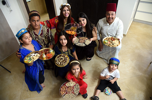 The Avitan family prepares for the Mimouna holiday that marks the end of Passover (Photo: Haim Hornstein)