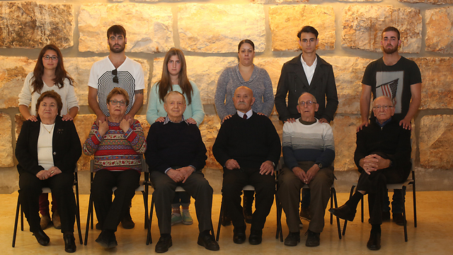 Holocaust survivors who will light candles at Yad Vashem ceremony with their grandchildren (Photo: Gil Yohanan)