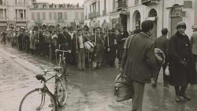 Tunisians being sent to hard labor during WWII