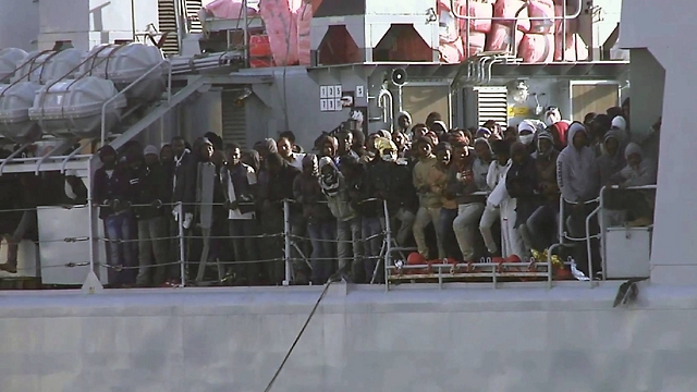 TV image of migrants saved from boat on Italian ship. (Photo: Associated Press)