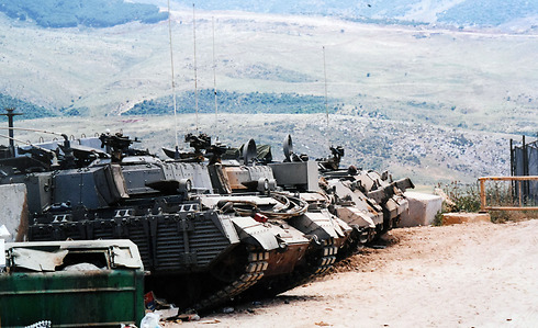 The heavily armored APCs waiting to take the troops back into Israel after the pullout.