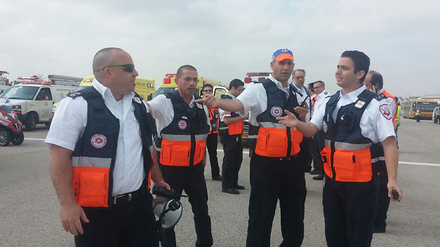 Magen David Adom paramedics waiting for the plane to land