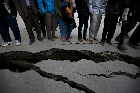 Cracks in the road cause by the earthquake in Nepal (Photo: Reuters)