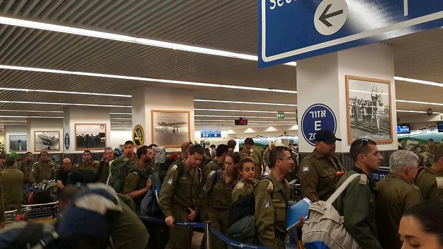 Members of the mission line up in the airport (Photo: Roi Yanovsky)