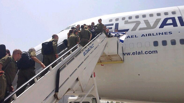 IDF search and rescue team boards the delayed flight to Nepal on Monday (Photo: Yoav Zitun) 