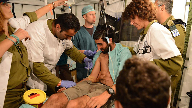 The IDF rescue team helping the injured at the field hospital (Photo: IDF Spokesman)