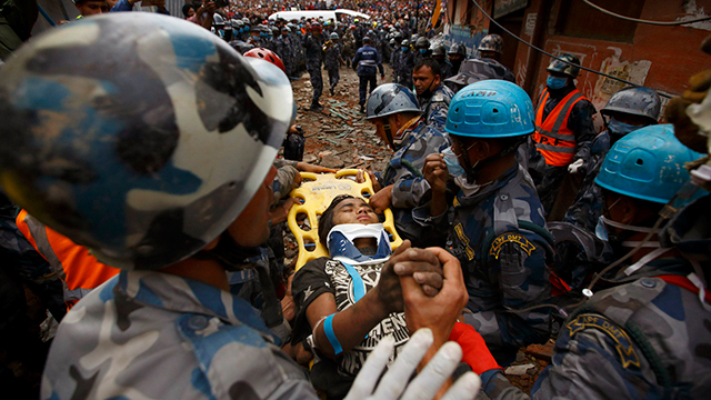 15-year-old Pemba Tamang being rescued (Photo: Reuters)