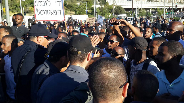 Ethiopian protestors face police. 'We are not transparent black people. We are citizens of the State of Israel just like you' (Photo: Ofer Meir)