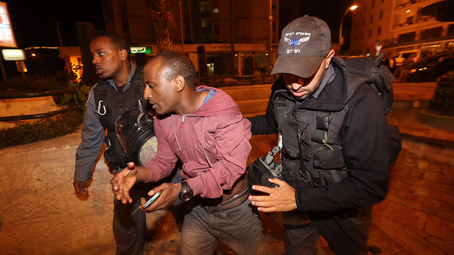 Ethiopian Israeli man arrested during protest. (Photo: Gil Yohanan)