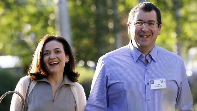 Sheryl Sandberg, Chief Operating Officerof Facebook, with her husband David Goldberg, CEO of SurveyMonkey (Photo: Reuters)