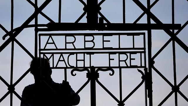 A blacksmith prepares a replica of the Dachau concentration camp gate at the main entrance of the memorial in Dachau (Photo: AP) (Photo: AP)