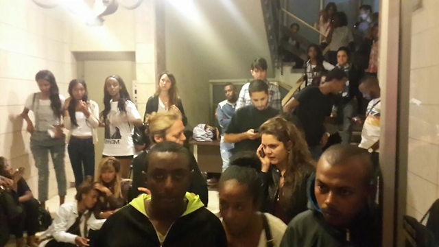 Israelis take refuge in apartment building near center of protest. (Photo: Itay Blumenthal)