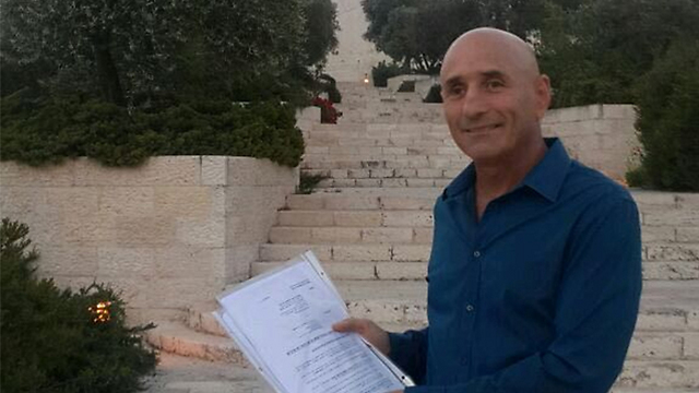 Yesh Atid MK Ofer Shelah with petition