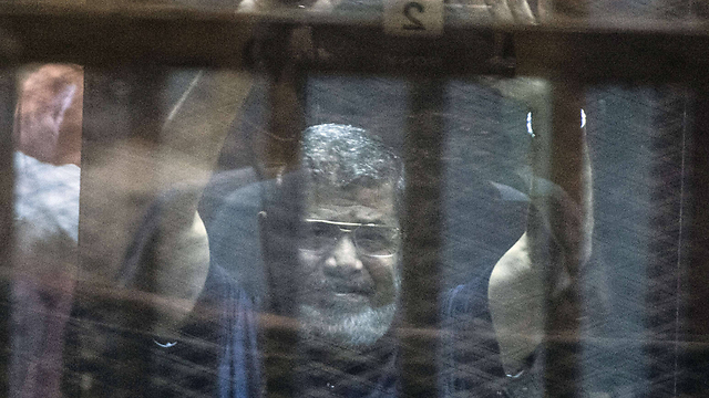 Former Egyptian president Mohamed Morsi on trial (Photo: AFP)