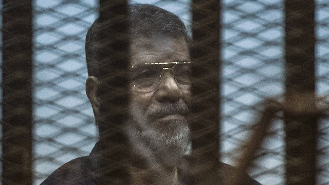 Former Egyptian president Mohammed Morsi in custody (Photo: AFP)