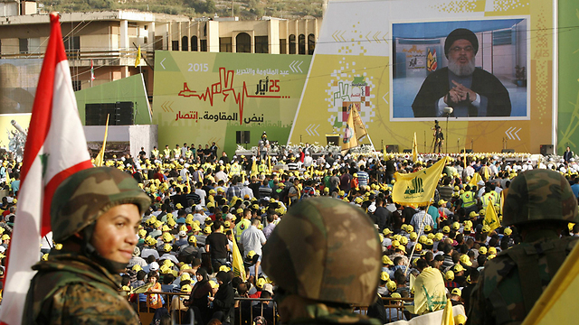 Nasrallah appears on-screen at a Hezbollah rally marking the anniversary of the IDF withdrawal from Lebanon, last month (Photo: AFP)