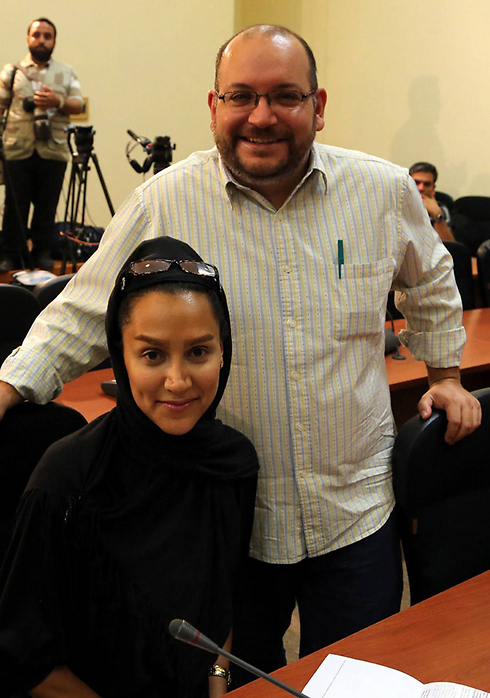 גם היא נעצרה ושוחררה. ג'ייסון רזאיאן ורעייתו יגאנה סאלחי (צילום: AFP) (צילום: AFP)