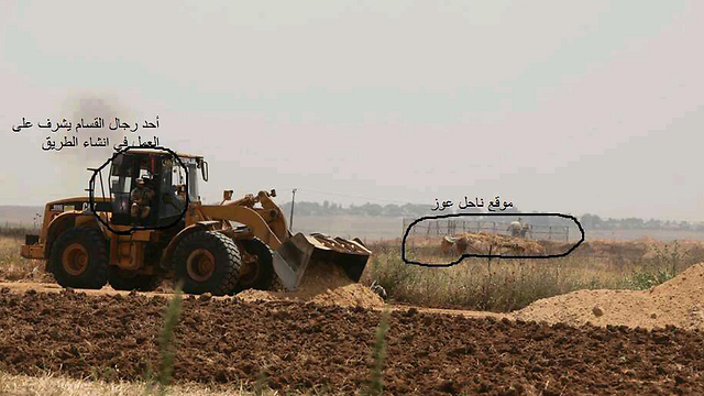 An armed militant on a tractor, and a military pillbox position