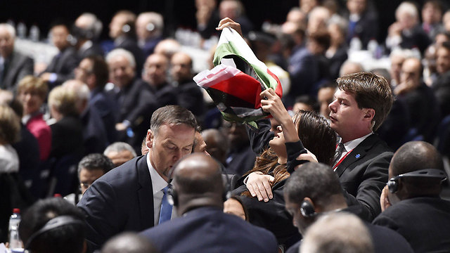 A pro-Palestinian protester interrupts Blatter's speech. (Photo: AFP) (Photo: AFP)