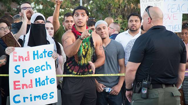 Counterprotesters calling for end to hate speech and hate crime (Photo: AFP)