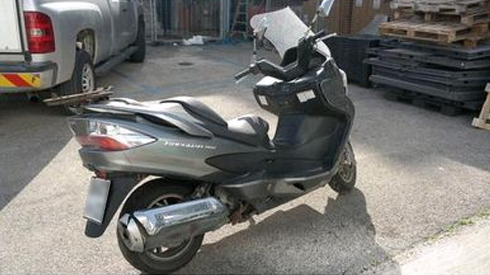 A Vespa is among the many items for sale