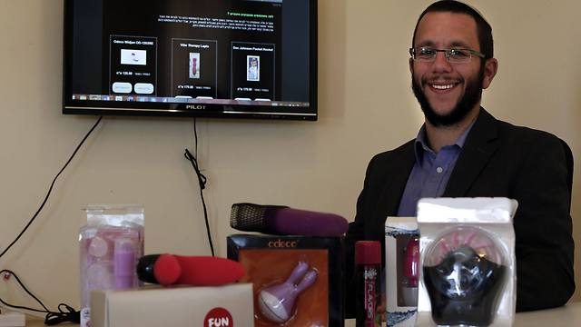 Natan Alexander poses in his office in Elazar in the West Bank with 'Kosher' sex toys (Photo: AFP)