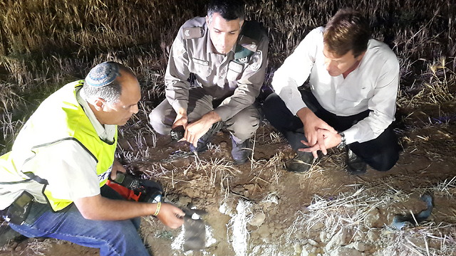 Sdot Negev officials inspect the remains of the rocket that struck Wednesday night. (Photo: Roi Idan)
